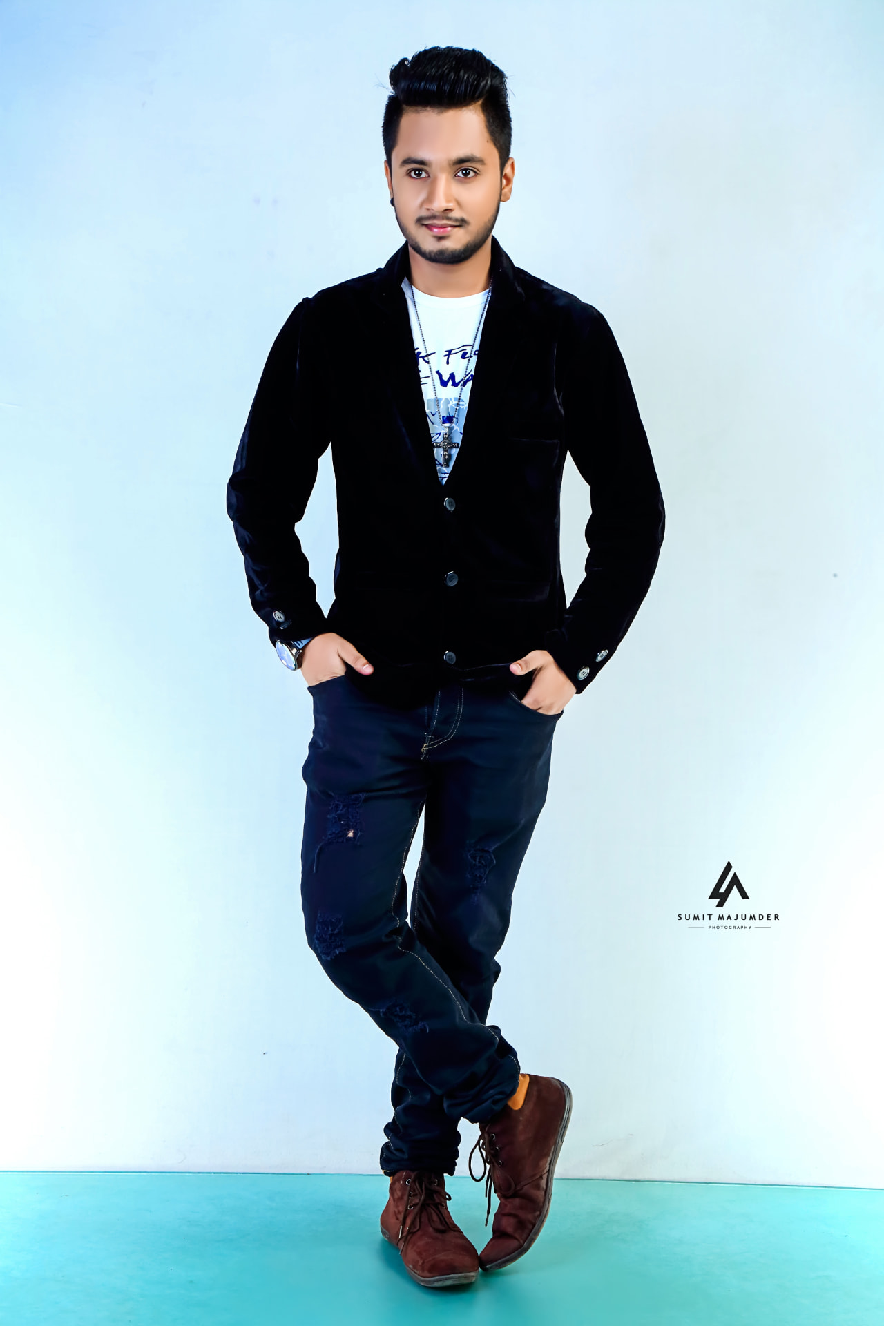 HaSiB Imam on set under a warm spotlight